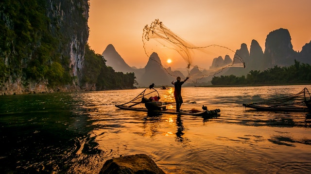 person-s-on-boat-throwing-fishing-net-3054187